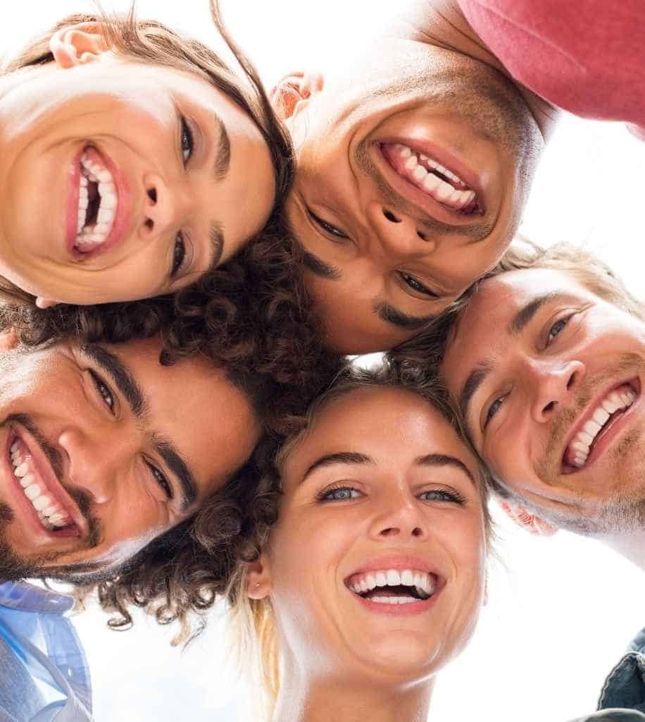 Smiling person showcasing white teeth after laser whitening treatment Slough